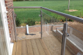 A bespoke railing overlooking a green field