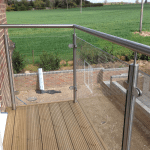 A bespoke railing overlooking a green field