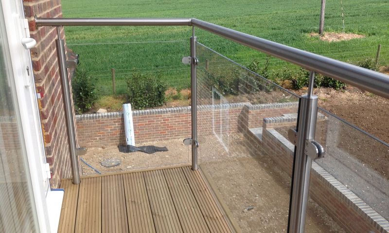 A bespoke railing overlooking a green field