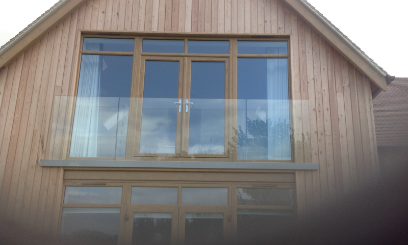 A clear glass panel balcony