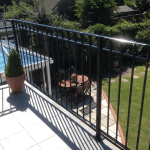 A metal railing balcony situated in the garden