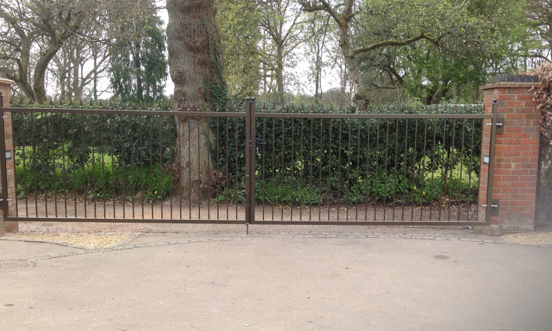 A Square, black gate with golden spikes