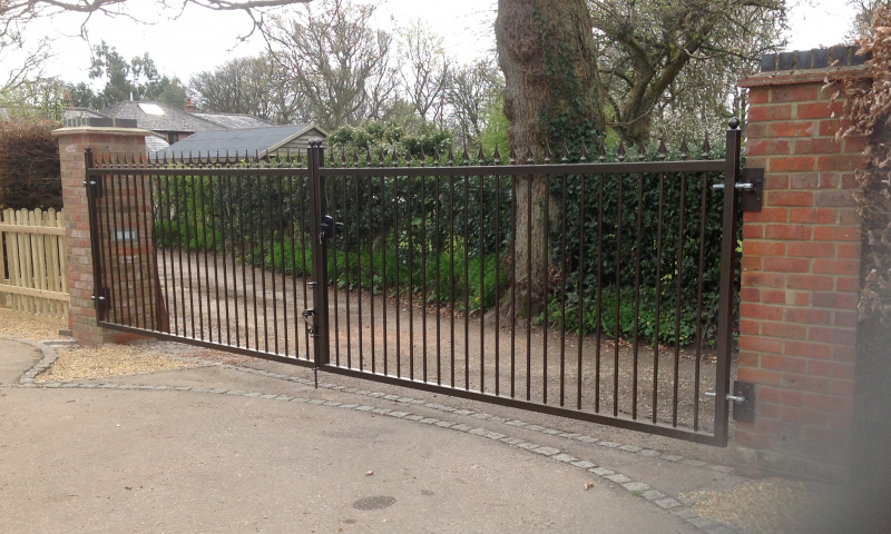 A Square, black gate with golden spikes