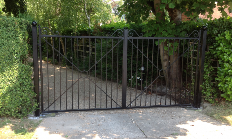 A square, black metal gate